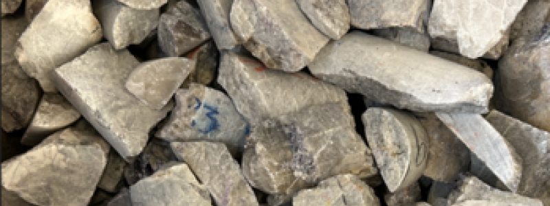 Pollucite concentrate (~12% Cs2O) produced from prior XRT ore sorting program (see news release dated October 9, 2025), of which a portion was used as feed for the bench-scale caesium extraction and recovery program through Koch Technology Solutions discussed herein. Photo: PMET Resources Inc.