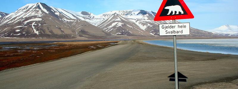 Road sign in Svalbard in the Arctic. Melting Antarctic ice could eventually expose even here significant mineral resources.  Photo: Wikipedia Commons license. Credit: Sprok