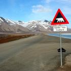 Road sign in Svalbard in the Arctic. Melting Antarctic ice could eventually expose even here significant mineral resources.  Photo: Wikipedia Commons license. Credit: Sprok
